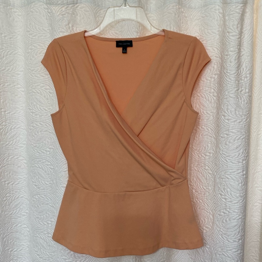 Gently used peplum top from the Limited, in color peach 🍑